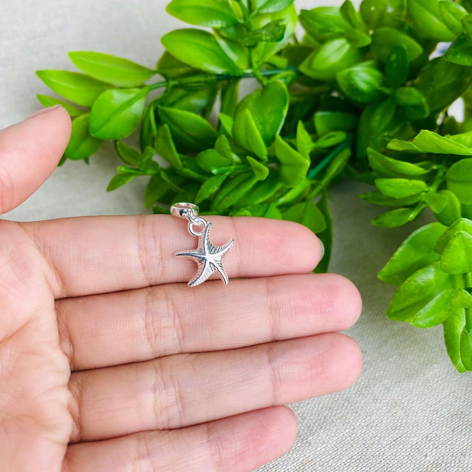 Berloque Estrela do Mar Banhado a Prata 925
